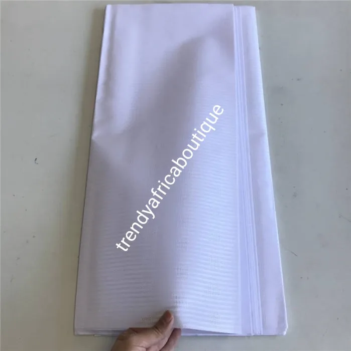 On Sale: Top quality pure white atiku swiss voile lace fabric for Nigerian Men native outfit. Soft quality fabric. Can be use for agbada/3pc outfit for men. Sold per 5yds. Price is for 5yds